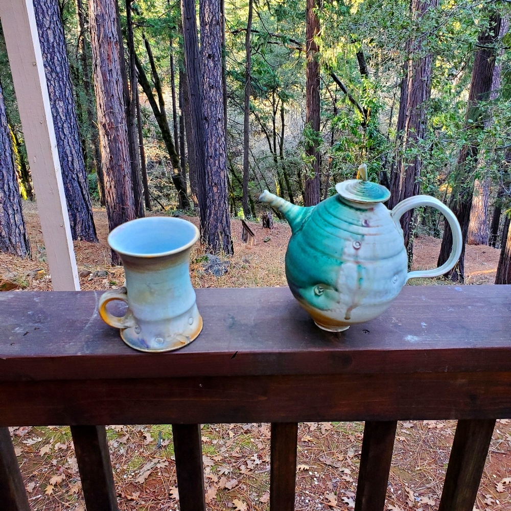 Handmade ceramic teapot and mug